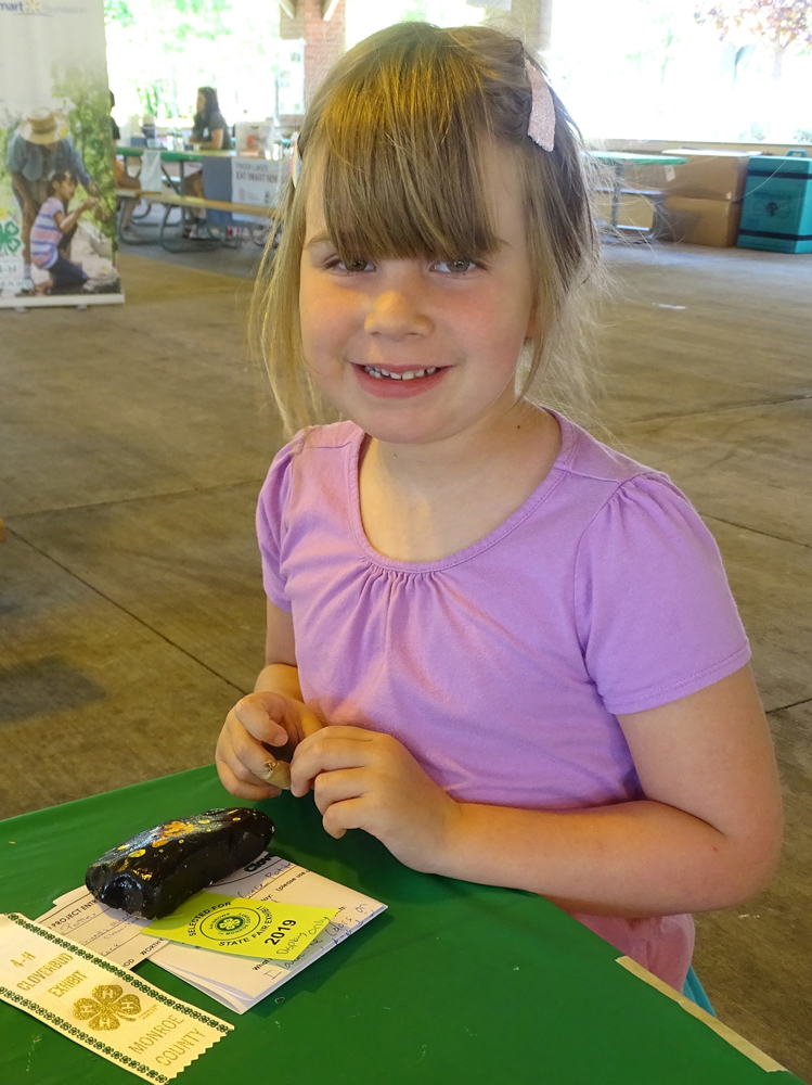 4-H club member Grace with her state-fair-bound 4-H project.